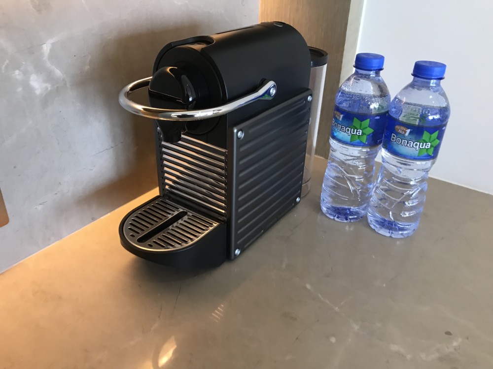 a machine next to water bottles