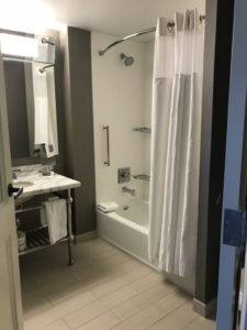 a bathroom with a shower and a sink